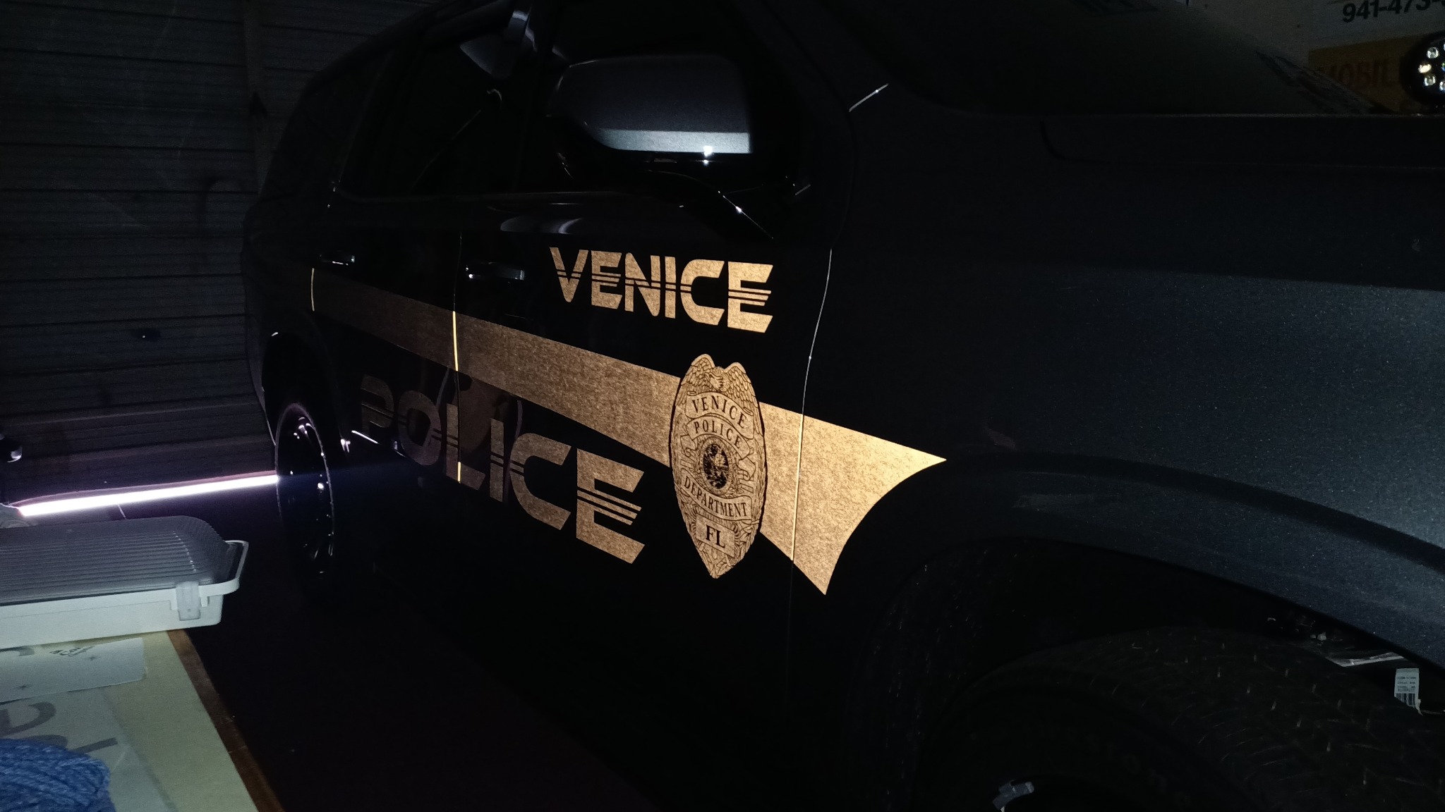 Reflective police and safety graphics glowing at night